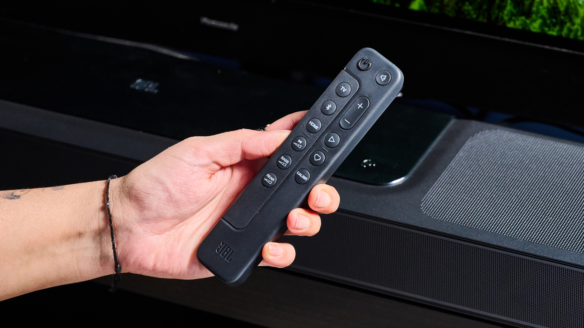 the jbl bar 1300x a black soundbar with HDMI ports, two surround channel speakers, a subwoofer wirelessly connected