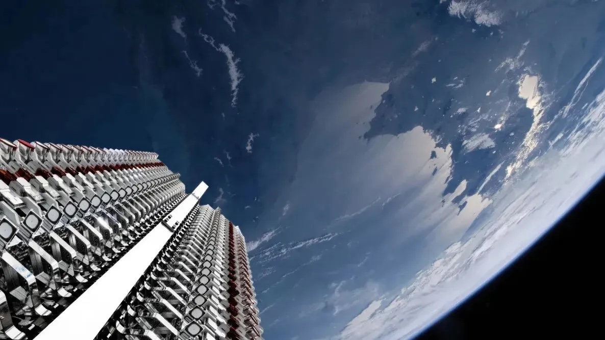 An image from Earth orbit with metal craft stacked on the left.