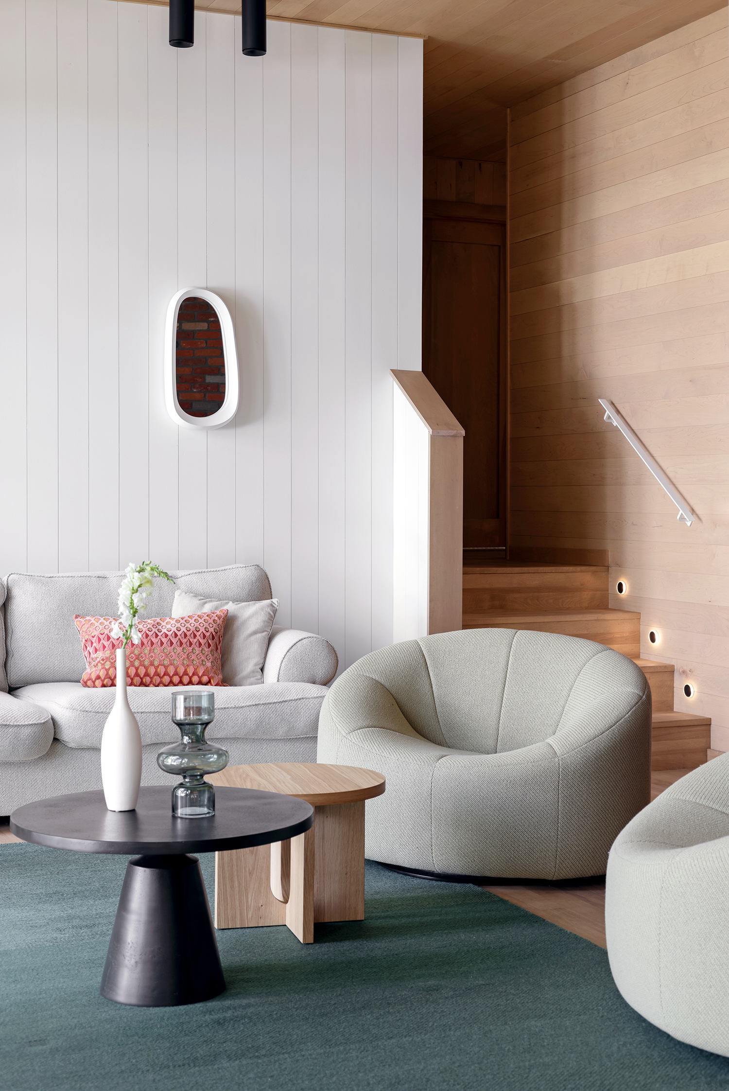 gray living room with forest green rug
