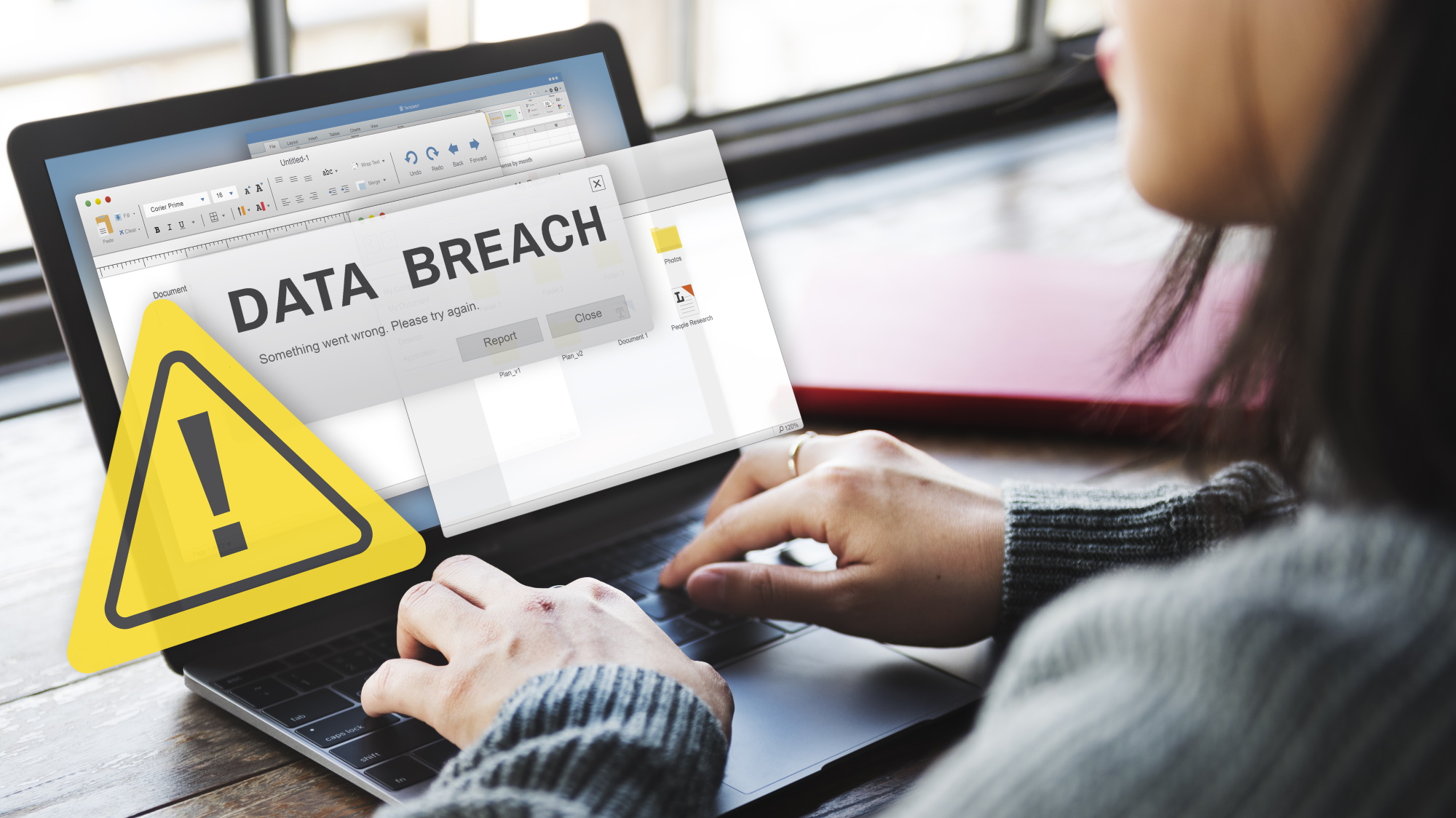 A data breach warning notification on a laptop