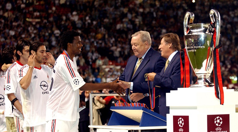 AC Milan players line up to receive their Champions League winners' medals
