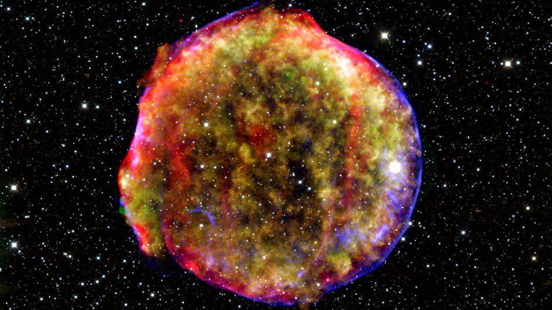An image of a rainbow-colored circular cloud with sparkling stars behind it