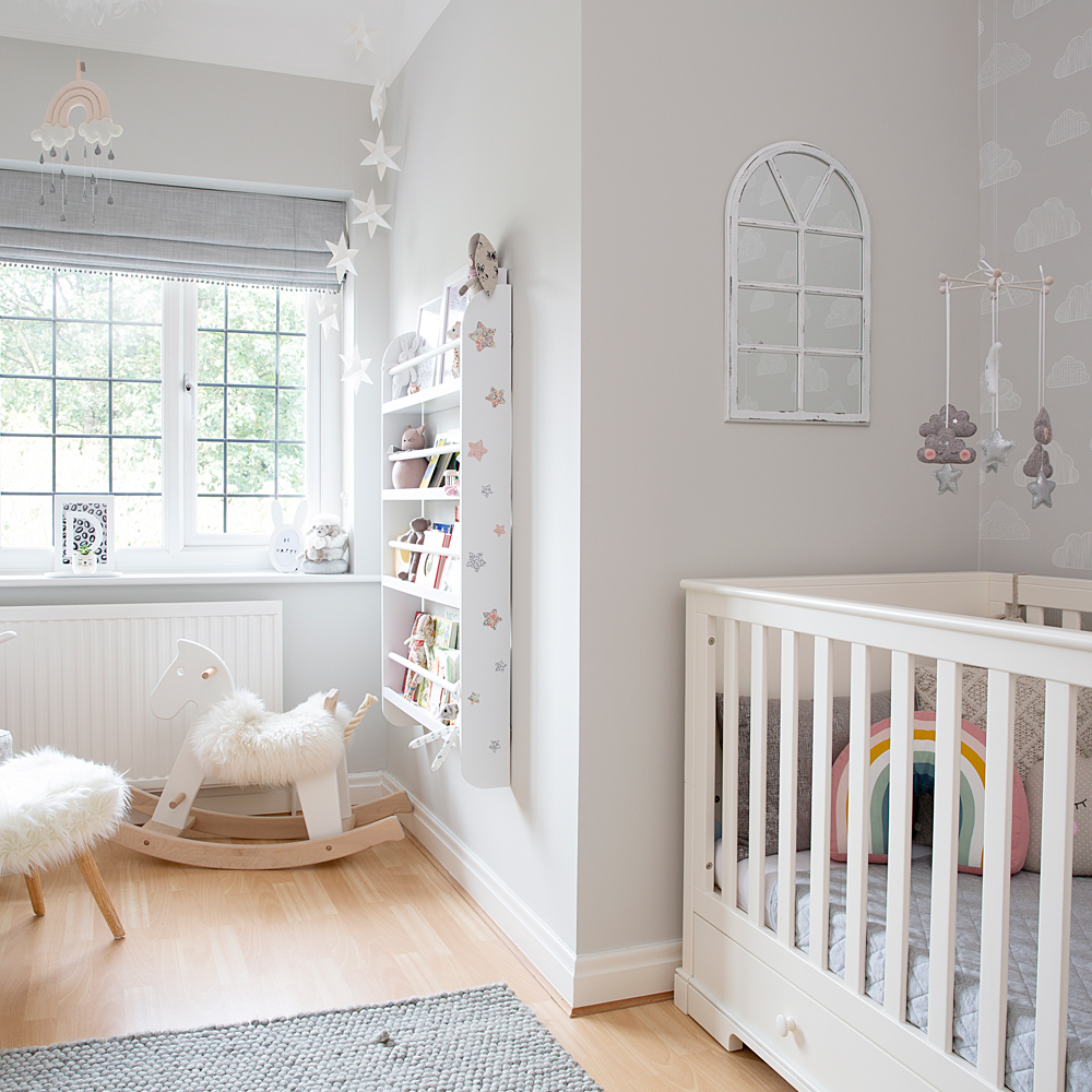 room with wooden flooring and cradle
