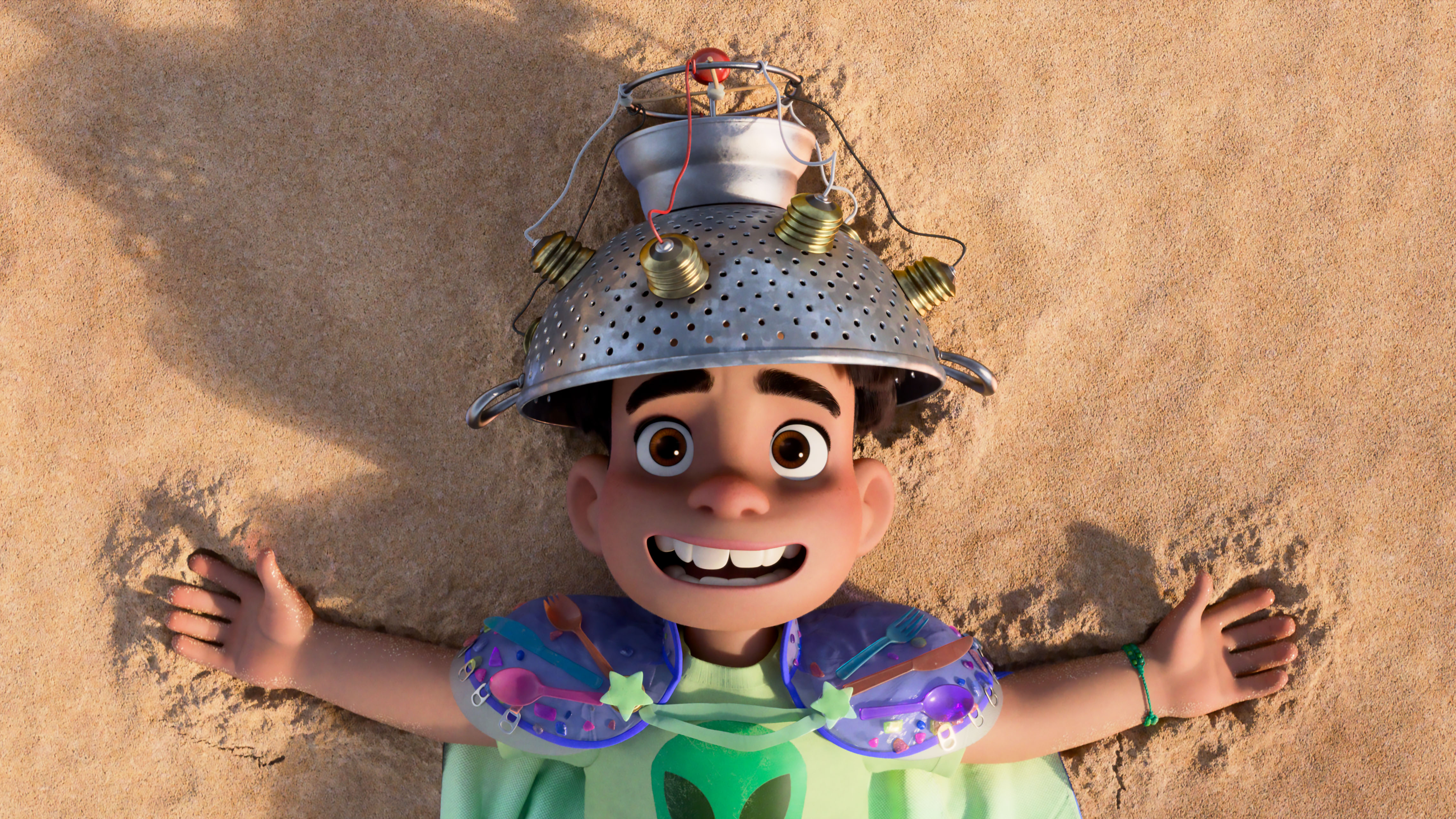 Elio lies on a beach in his cap and collander hat in a scene from &quot;Elio&quot;